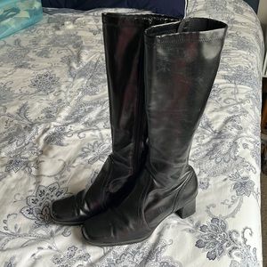 Knee high, 2 inch heal zip boots.